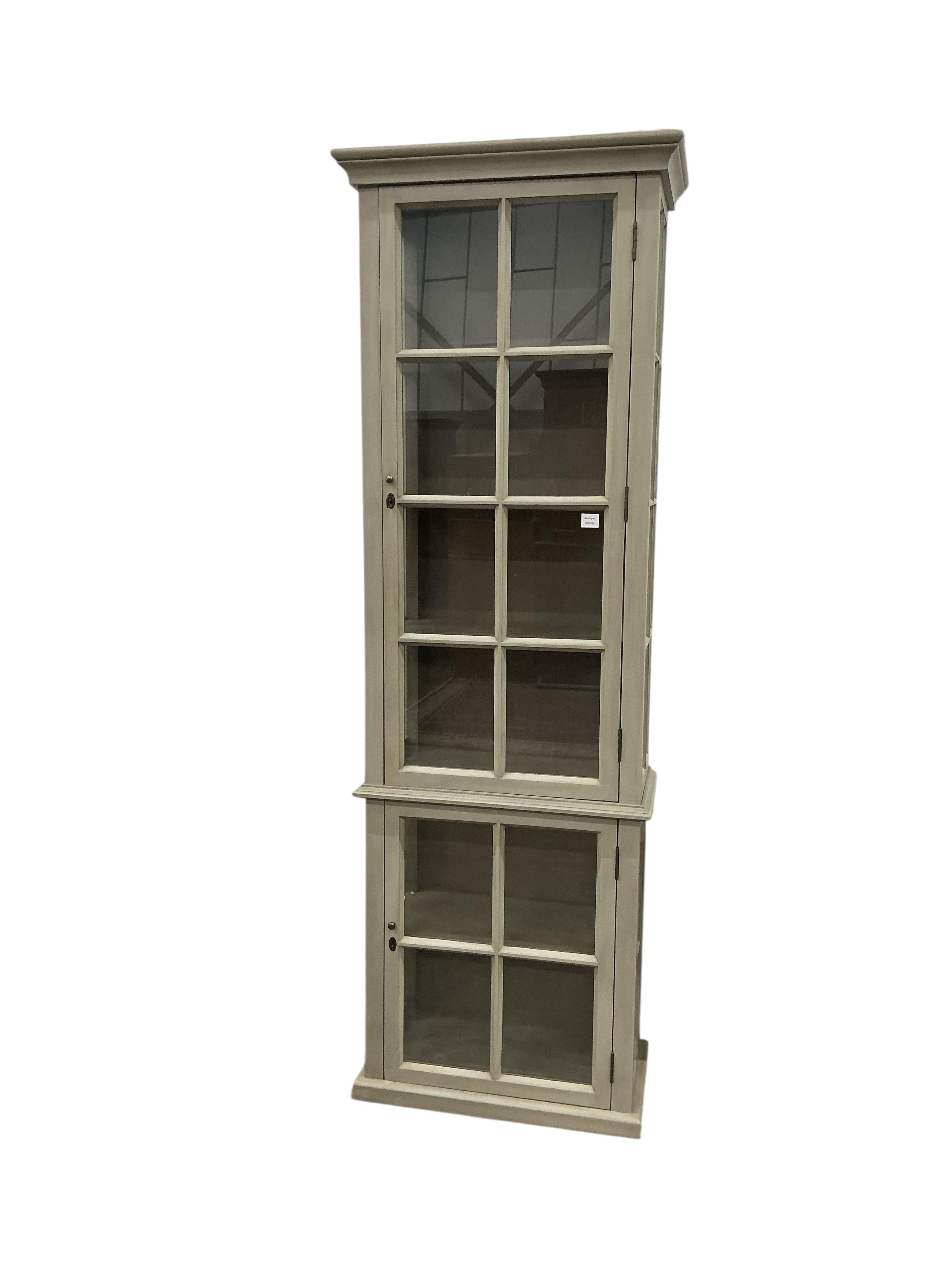 A Contemporary painted narrow cabinet, in two parts, width 73cm, depth 39cm, height 130cm